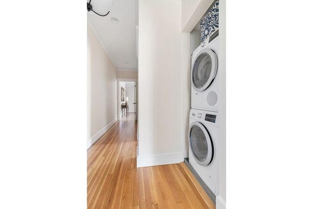 a view of a hallway with washer and dryer