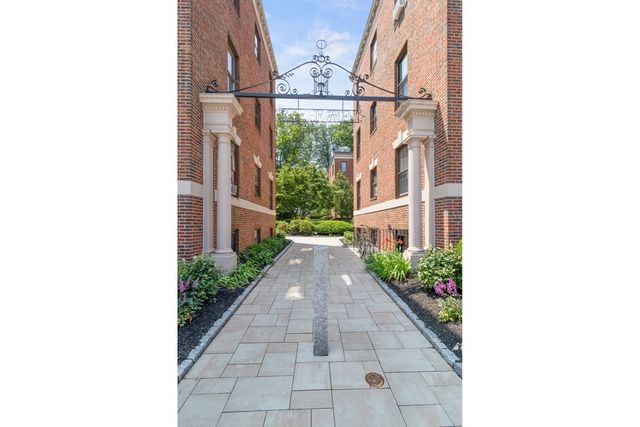 a hallway with couches next to a yard