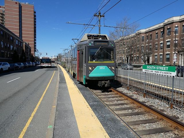 a sign board with parking space