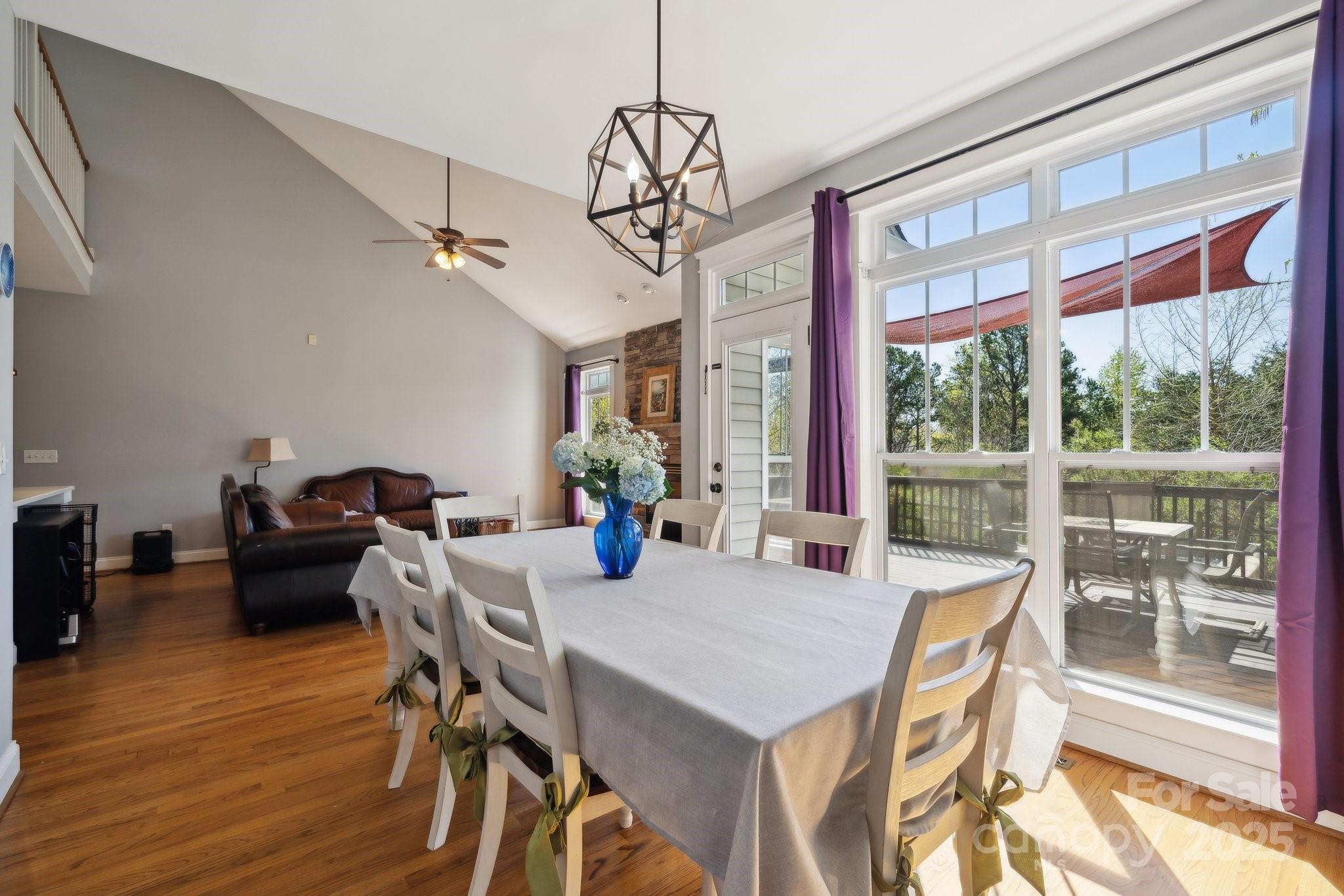 369 Shoreline Parkway Tega Cay, SC 29708 - Photo 13 of 40 a view of a dining room with furniture window and outside view