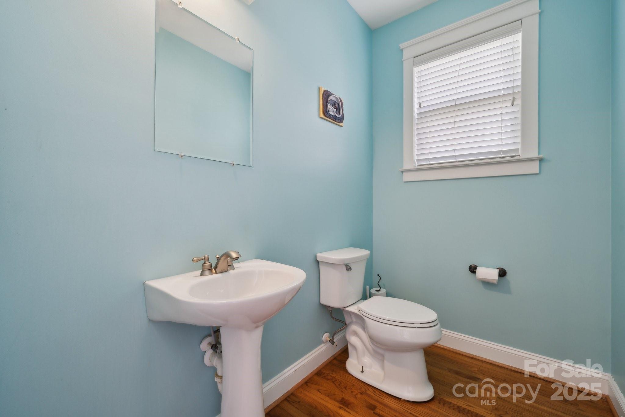 369 Shoreline Parkway Tega Cay, SC 29708 - Photo 14 of 40 a bathroom with a toilet sink and mirror