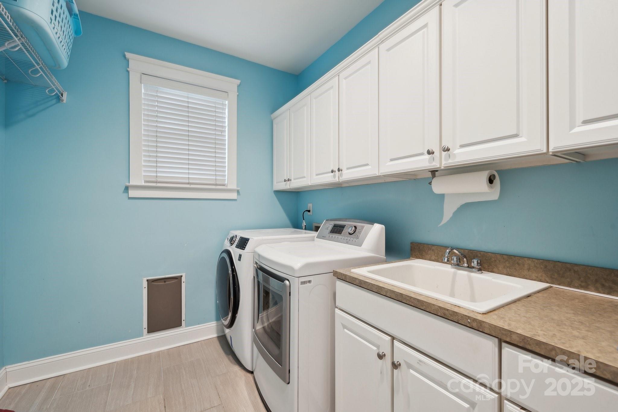 369 Shoreline Parkway Tega Cay, SC 29708 - Photo 15 of 40 a utility room with dryer and washer