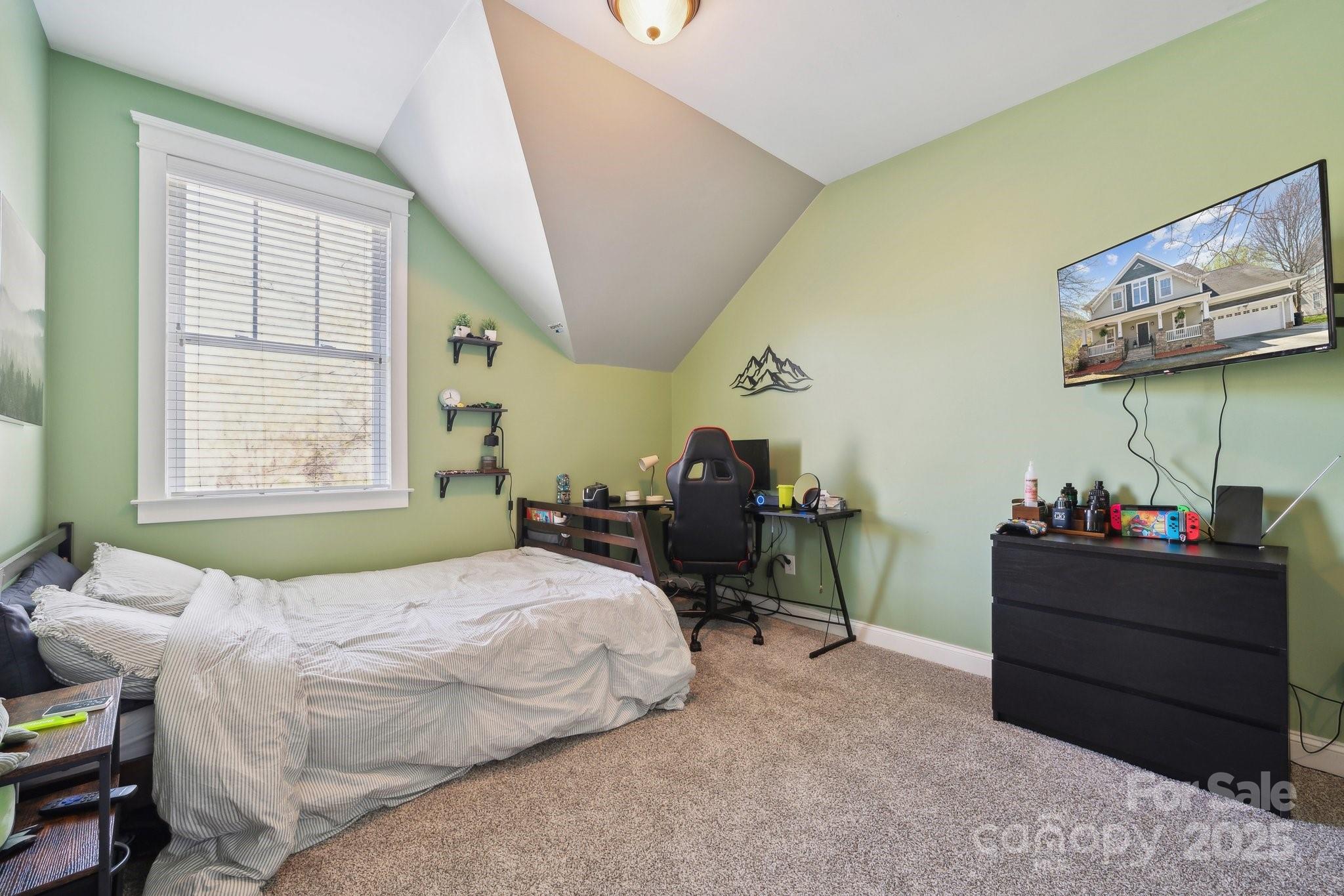 369 Shoreline Parkway Tega Cay, SC 29708 - Photo 20 of 40 a bedroom with a bed and a dresser