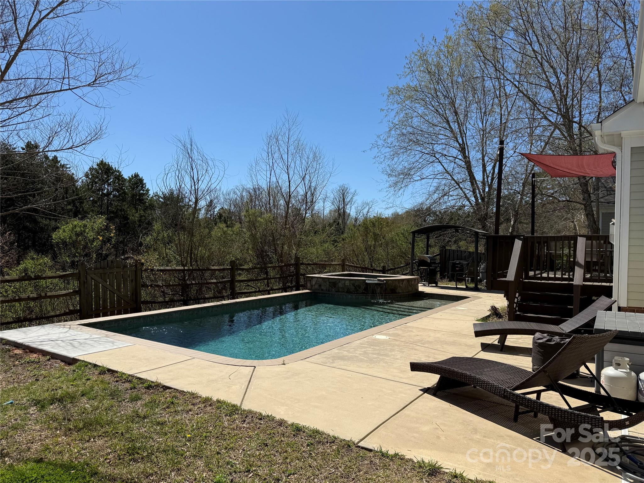 369 Shoreline Parkway Tega Cay, SC 29708 - Photo 2 of 40 a view of a swimming pool with a yard