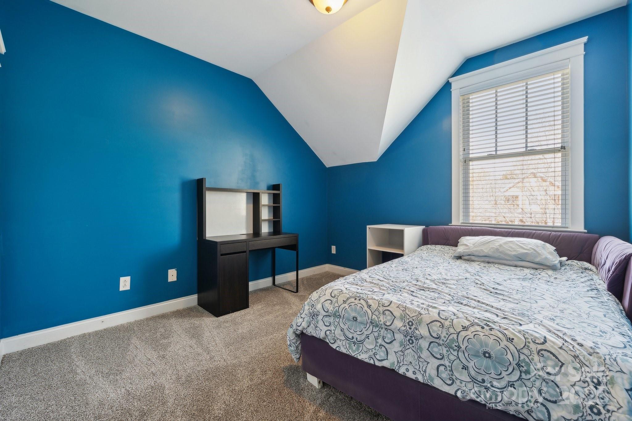 369 Shoreline Parkway Tega Cay, SC 29708 - Photo 23 of 40 a bedroom with a bed and a window