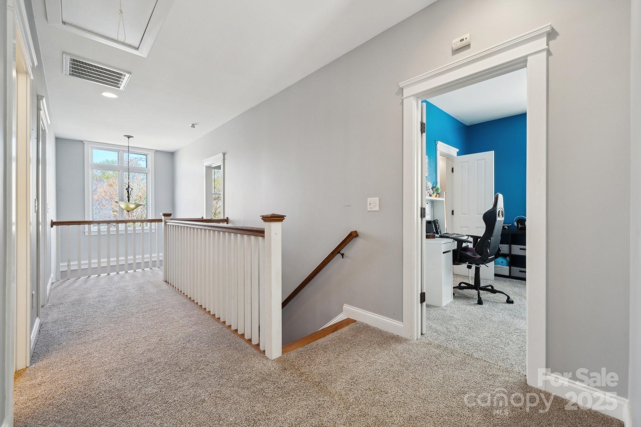 369 Shoreline Parkway Tega Cay, SC 29708 - Photo 29 of 40 a view of a hallway view with staircase