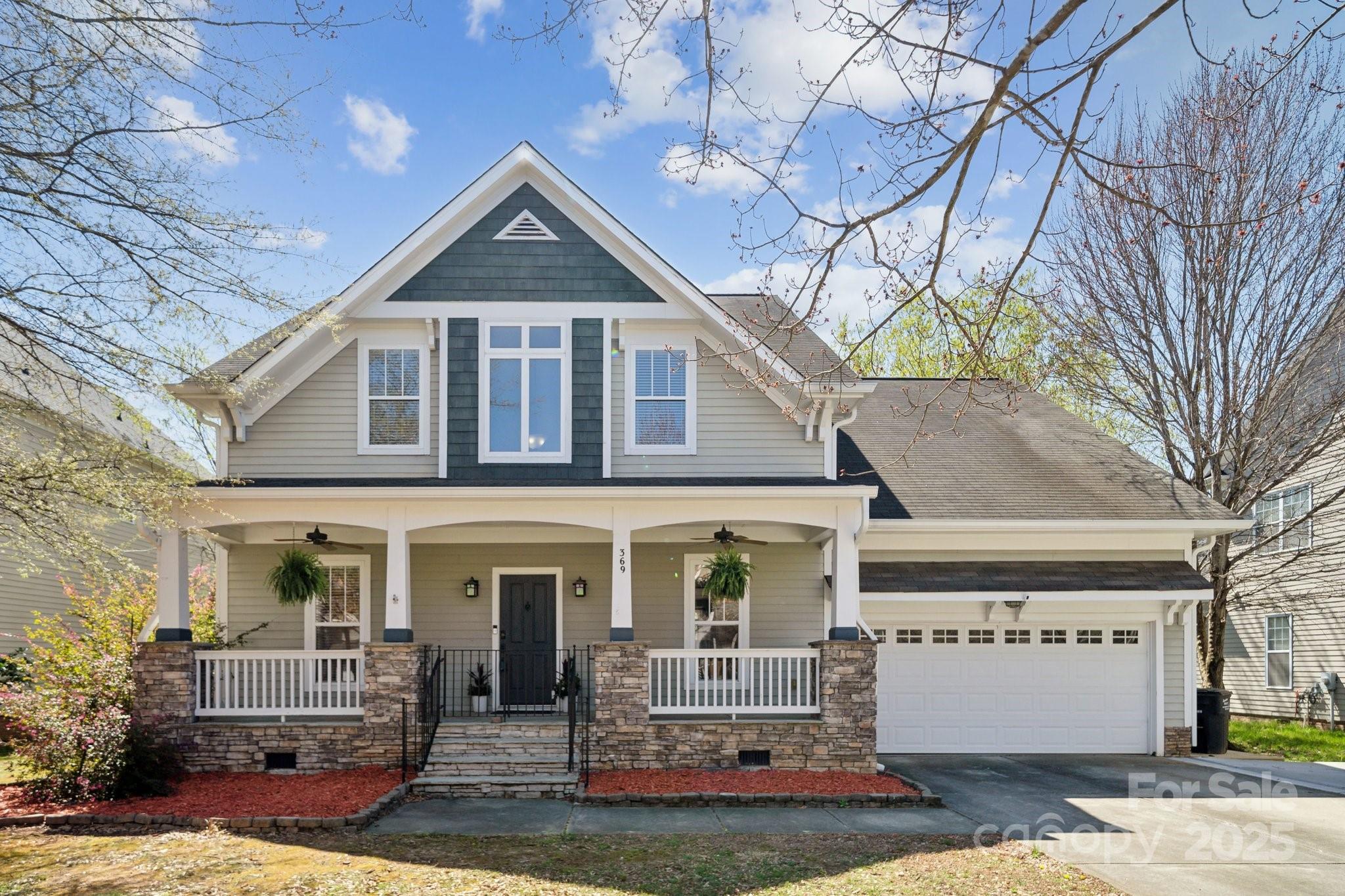 369 Shoreline Parkway Tega Cay, SC 29708 - Photo 38 of 40 a front view of a house with garden