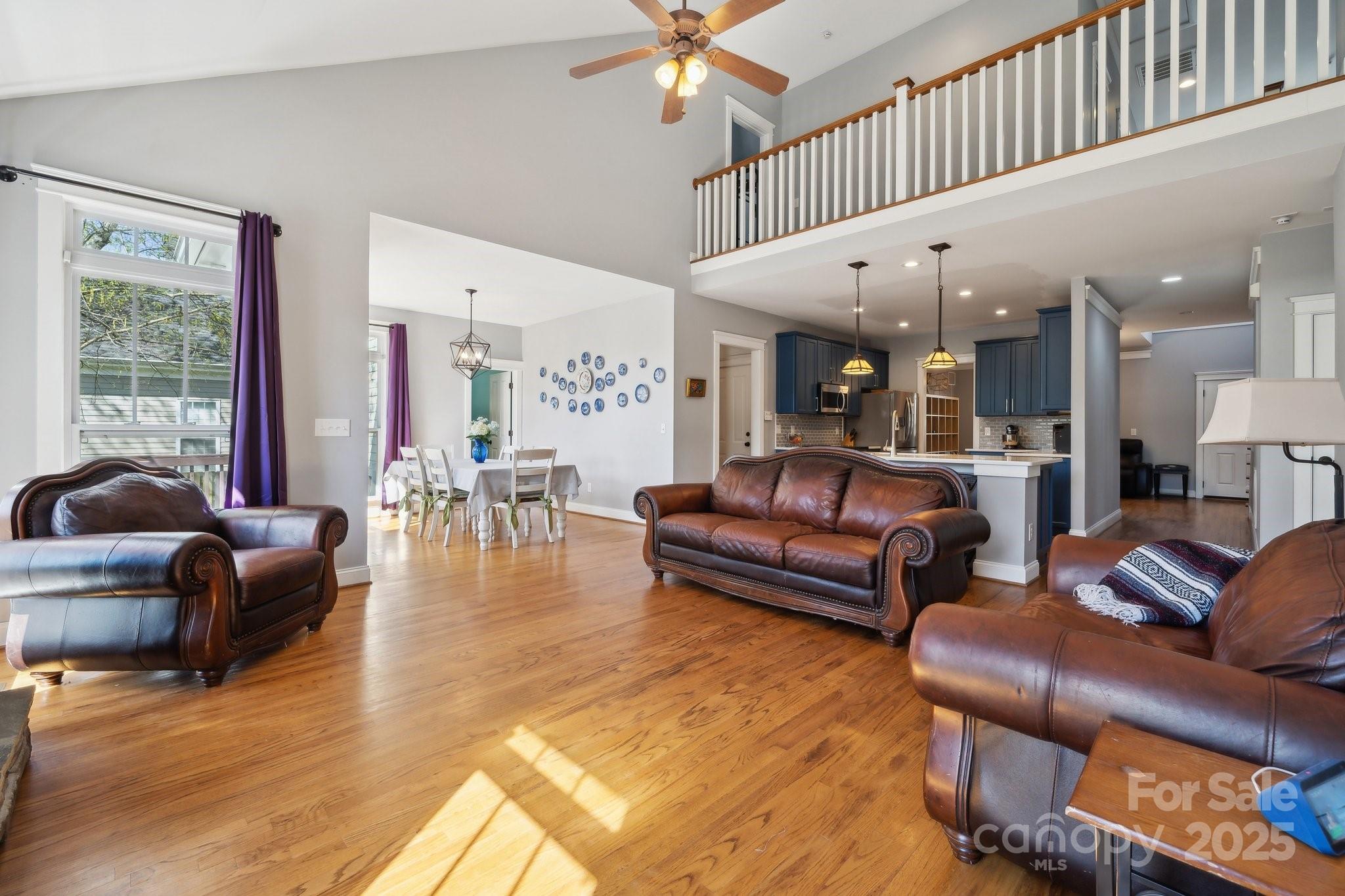 369 Shoreline Parkway Tega Cay, SC 29708 - Photo 10 of 40 a living room with furniture and wooden floor