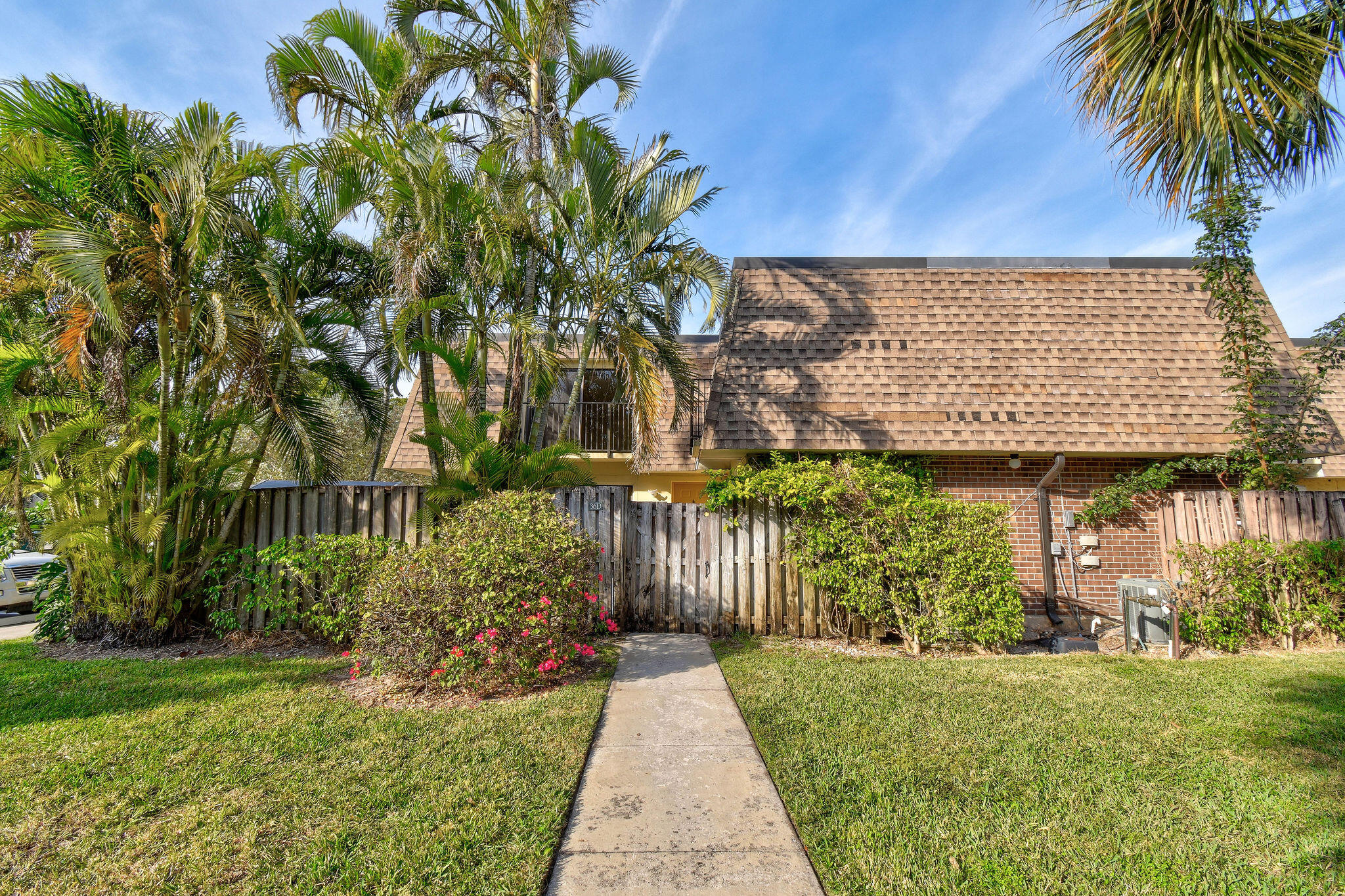 2913 Southwest 22nd Circle, Unit 36D Delray Beach, FL 33445 - Photo 1 of 33 a view of a pathway with a park
