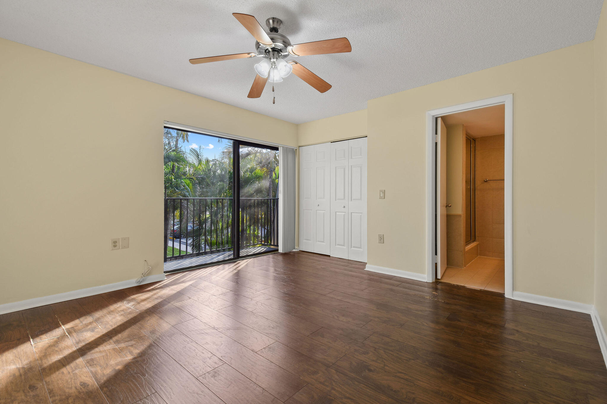 2913 Southwest 22nd Circle, Unit 36D Delray Beach, FL 33445 - Photo 15 of 33 a view of an empty room with wooden floor and a window