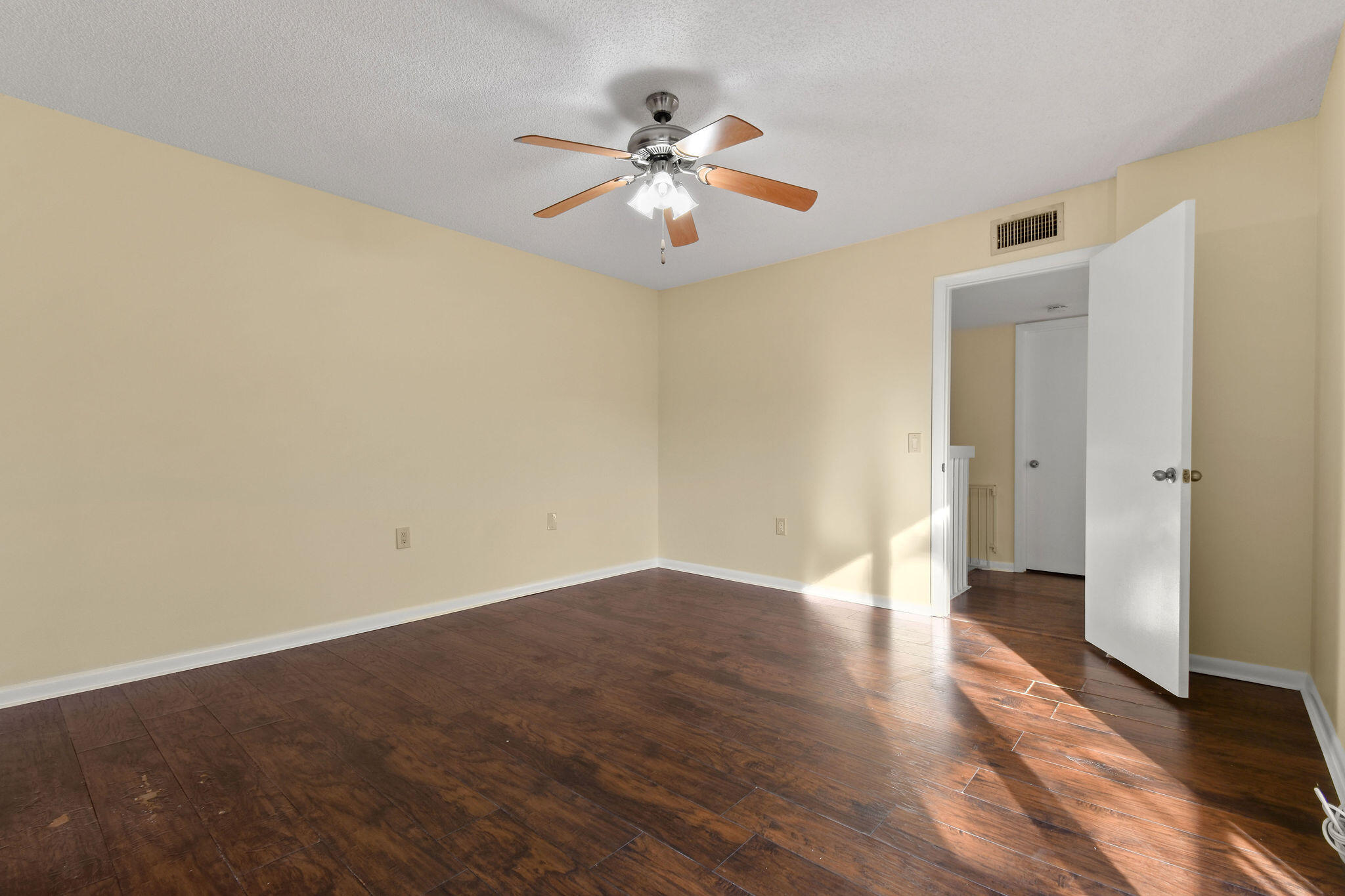 2913 Southwest 22nd Circle, Unit 36D Delray Beach, FL 33445 - Photo 20 of 33 wooden floor in an empty room with a window