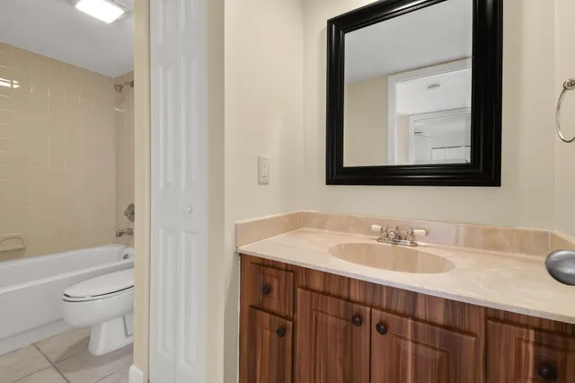 a bathroom with a toilet and a bathtub