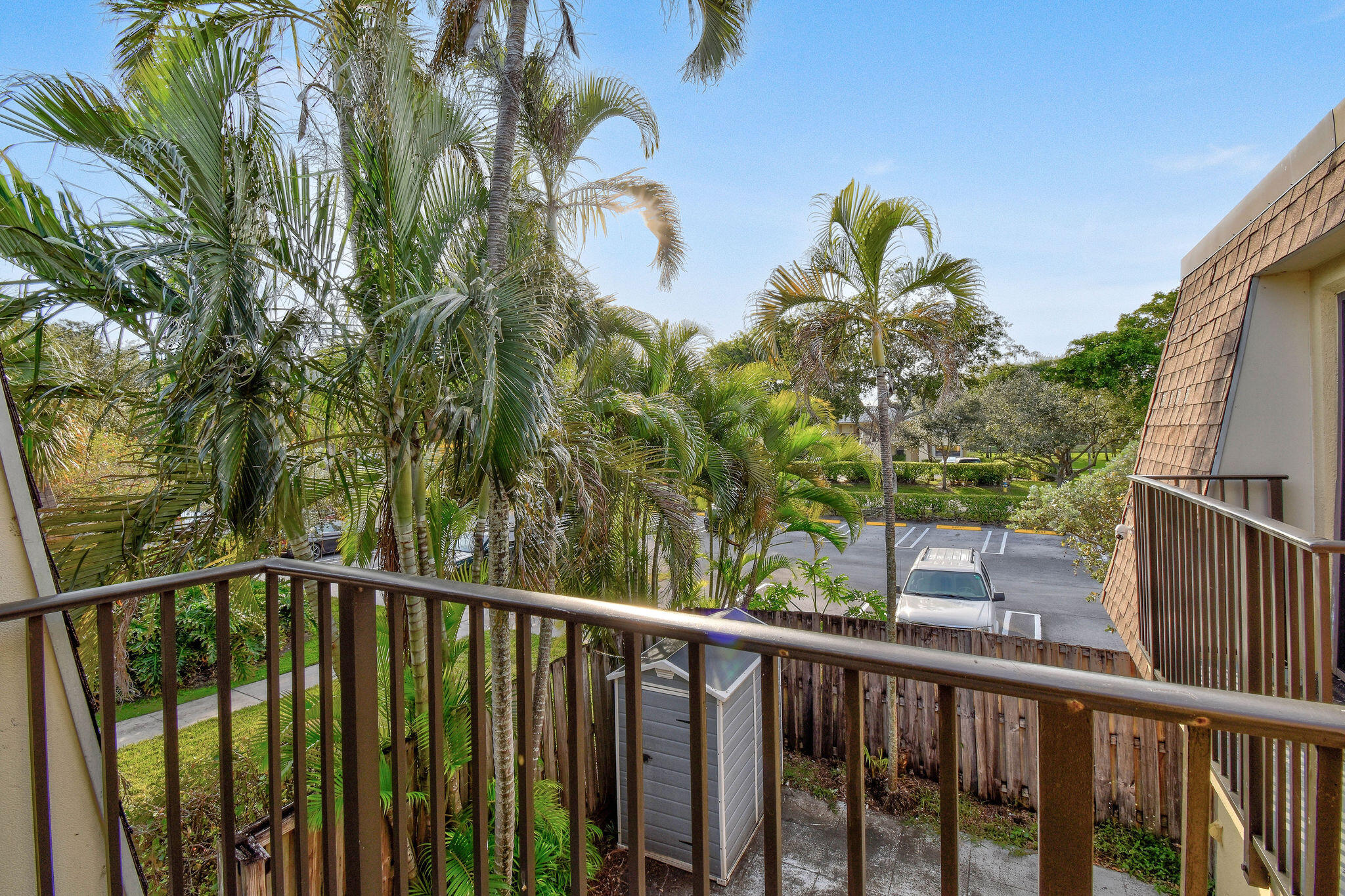 2913 Southwest 22nd Circle, Unit 36D Delray Beach, FL 33445 - Photo 28 of 33 a view of a balcony with wooden floor and fence