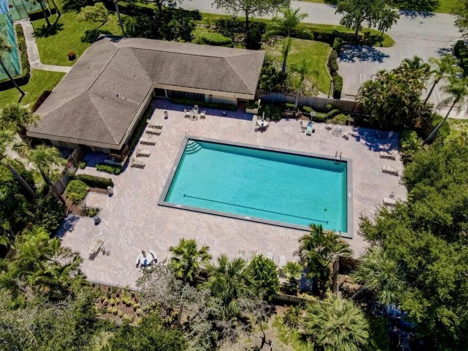 2913 Southwest 22nd Circle, Unit 36D Delray Beach, FL 33445 - Photo 29 of 33 an aerial view of a house with a yard and lake view