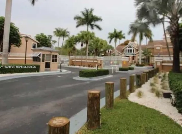 a view of multiple houses with yard