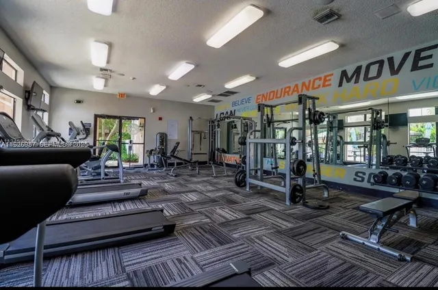 a living room with lots of furniture and a rug