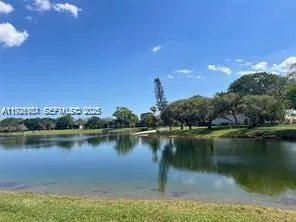 a view of a patio with a table and chairs