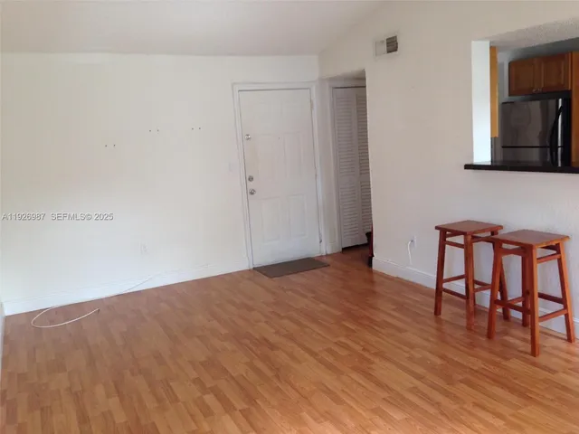 a view of livingroom with furniture and wooden floor