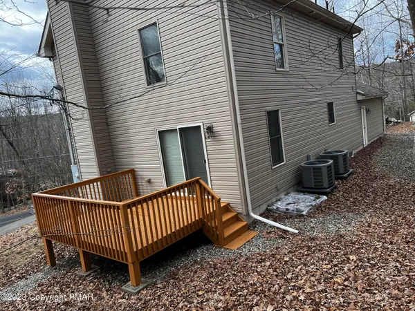 a view of a chairs with wooden fence
