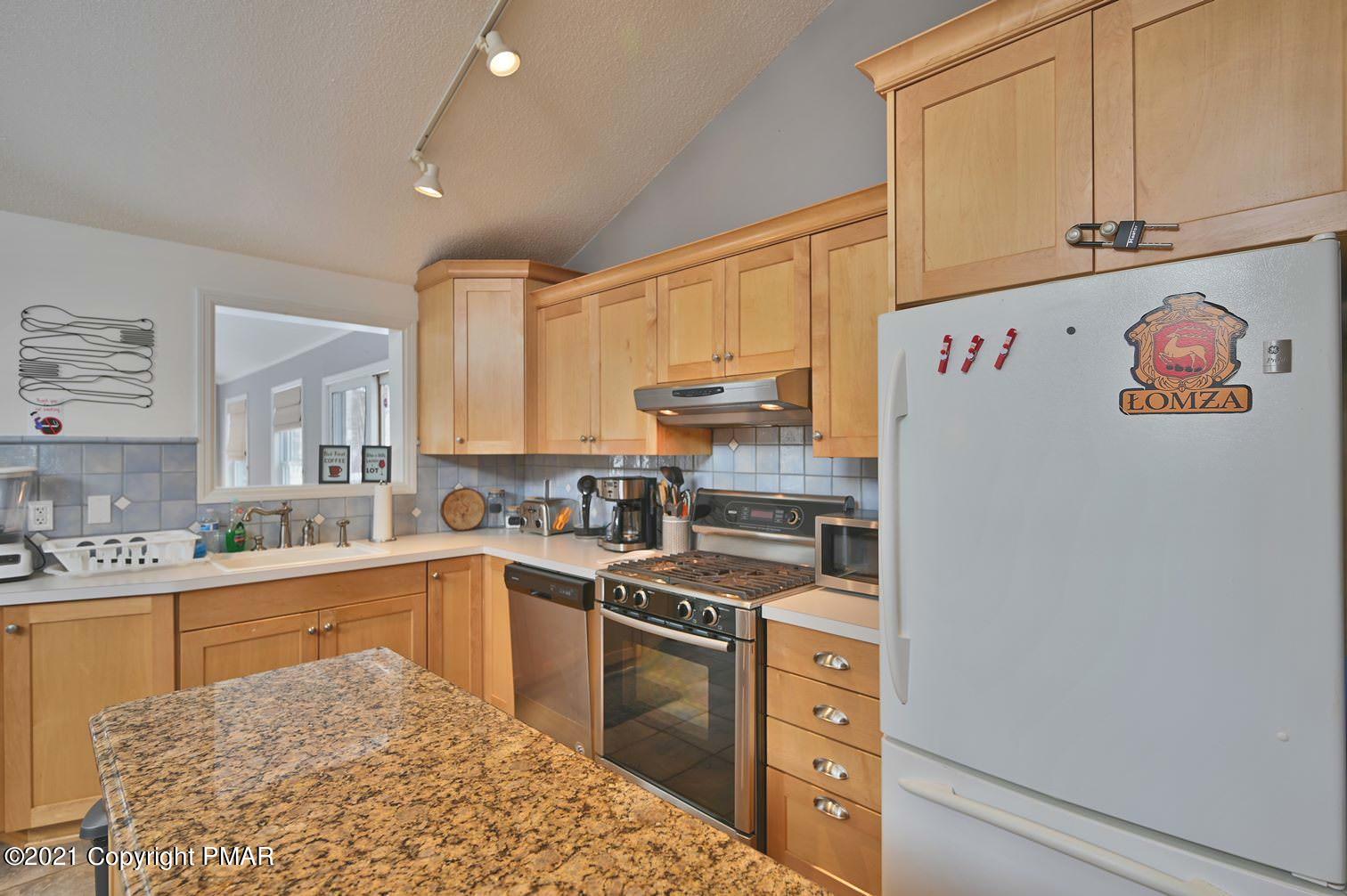 213 Boulder Road Lake Ariel, PA 18436 - Photo 25 of 78 a kitchen with a sink stove and cabinets