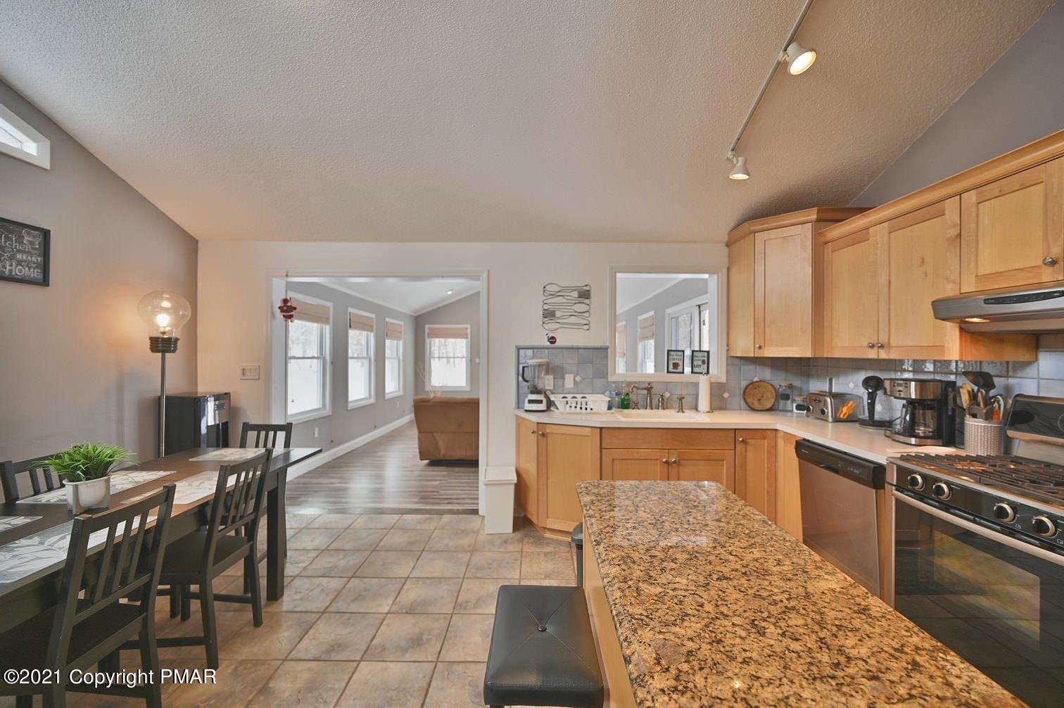213 Boulder Road Lake Ariel, PA 18436 - Photo 26 of 78 a large kitchen with lots of counter top space and stainless steel appliances