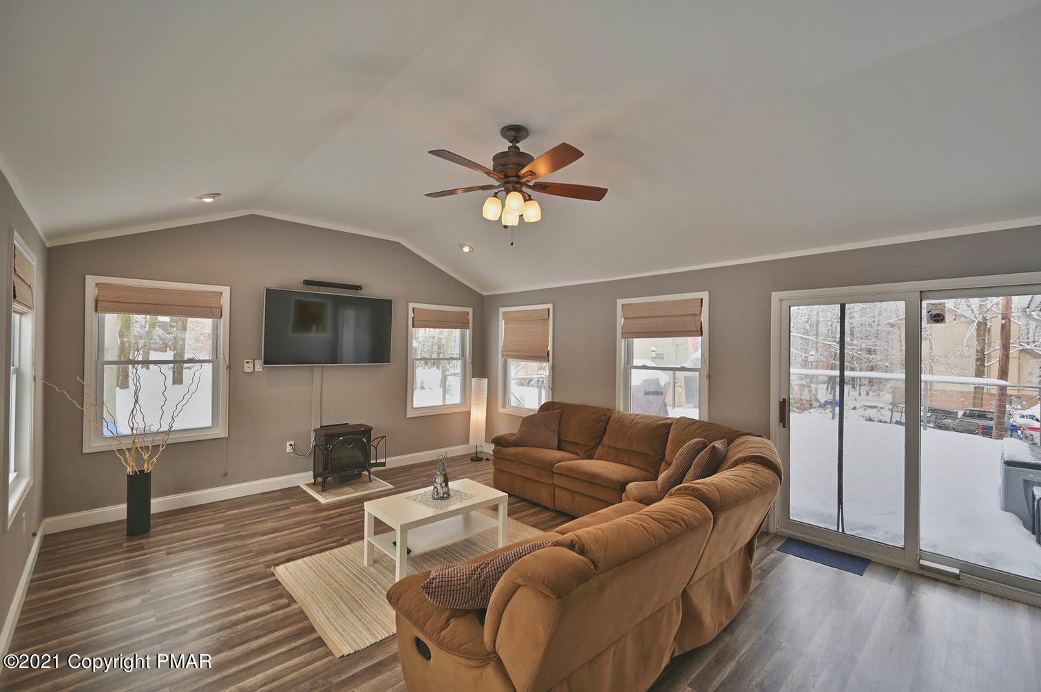 213 Boulder Road Lake Ariel, PA 18436 - Photo 29 of 78 a living room with furniture fireplace and a flat screen tv