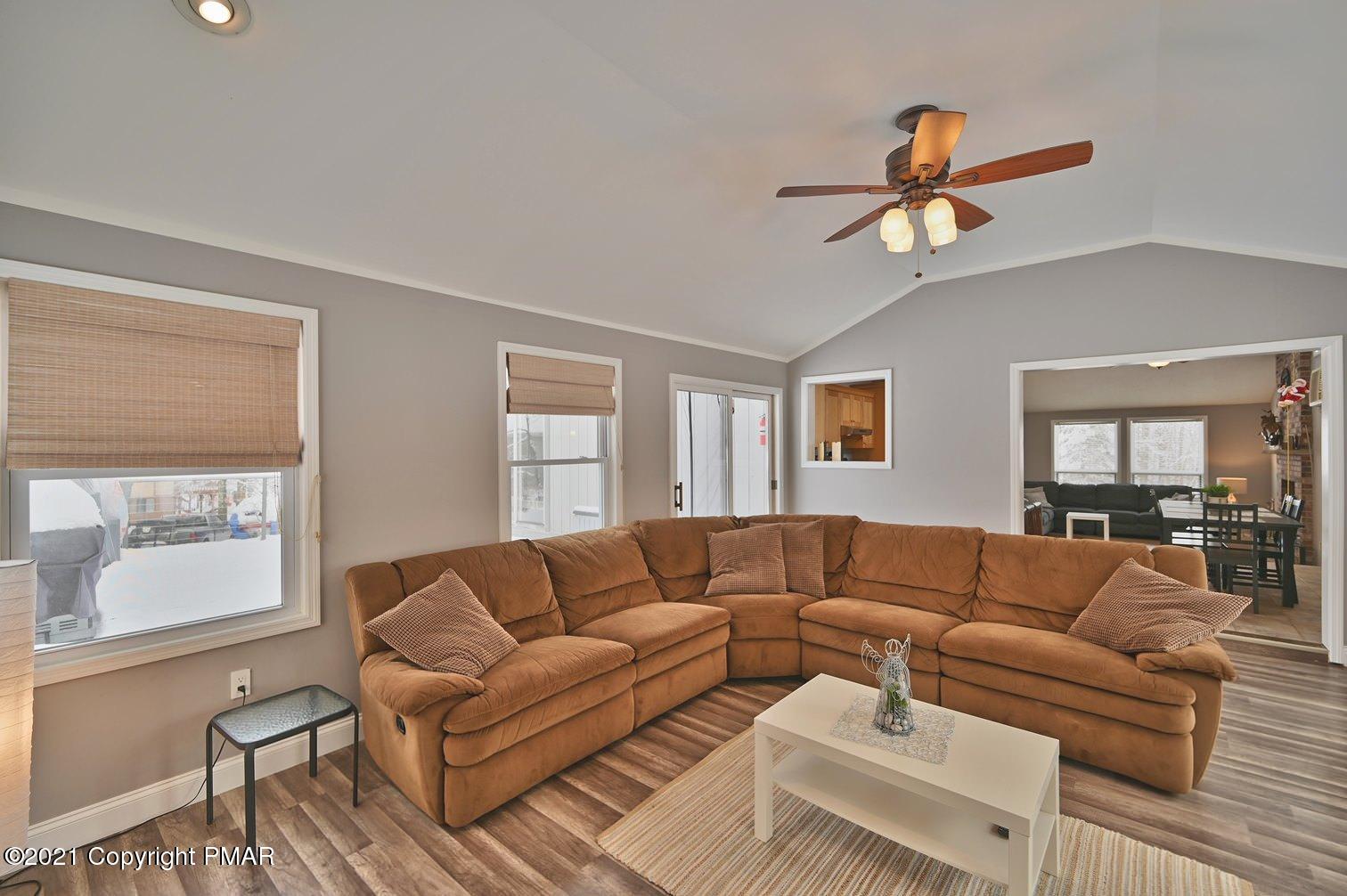 213 Boulder Road Lake Ariel, PA 18436 - Photo 32 of 78 a living room with furniture a ceiling fan and a window