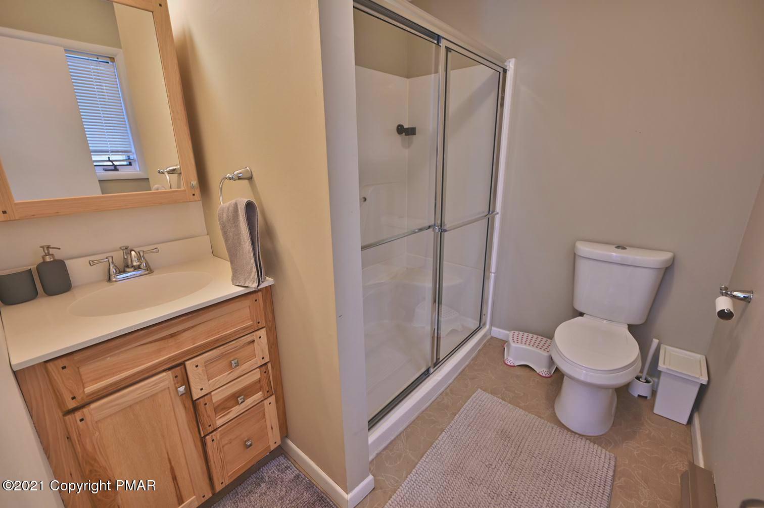 213 Boulder Road Lake Ariel, PA 18436 - Photo 38 of 78 a bathroom with a toilet sink and shower