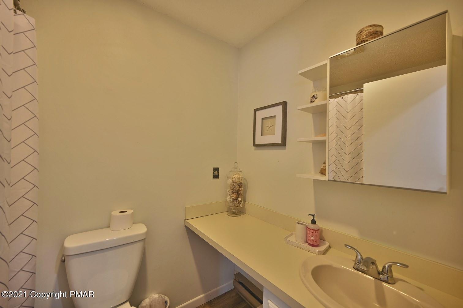 213 Boulder Road Lake Ariel, PA 18436 - Photo 44 of 78 a bathroom with a sink and a toilet