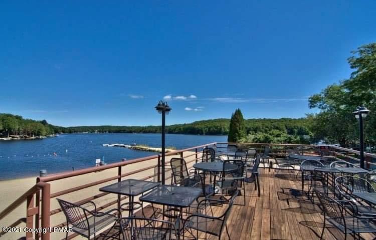 213 Boulder Road Lake Ariel, PA 18436 - Photo 72 of 78 a view of swimming pool with outdoor seating and lake
