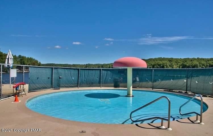 213 Boulder Road Lake Ariel, PA 18436 - Photo 73 of 78 a backyard of a house with table and chairs