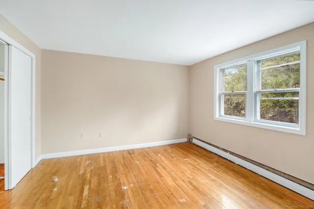 a view of an empty room with a window