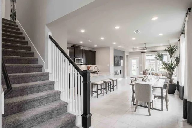 a view of entryway and hall with dining room
