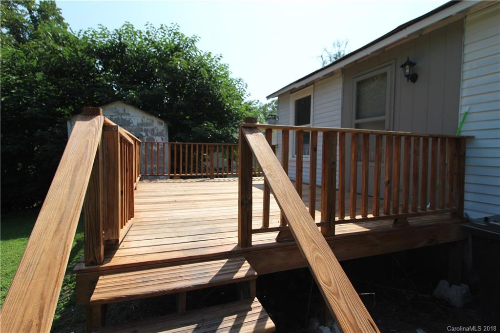 303 McConnell Street, Unit 71 Clover, SC 29710 - Photo 13 of 14 a view of deck with wooden floor and stairs