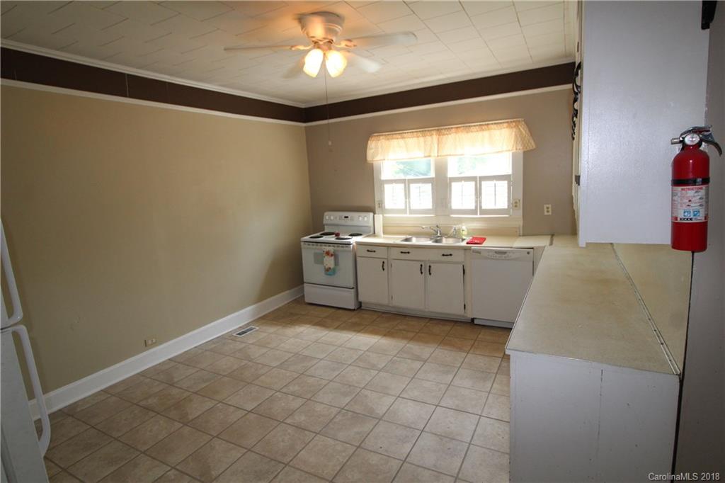 303 McConnell Street, Unit 71 Clover, SC 29710 - Photo 6 of 14 a view of a kitchen with a sink cabinet and a window