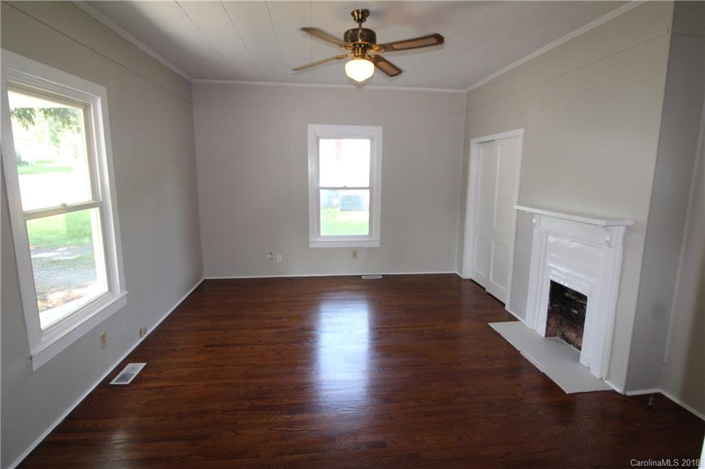 303 McConnell Street, Unit 71 Clover, SC 29710 - Photo 8 of 14 a view of empty room with wooden floor and fan