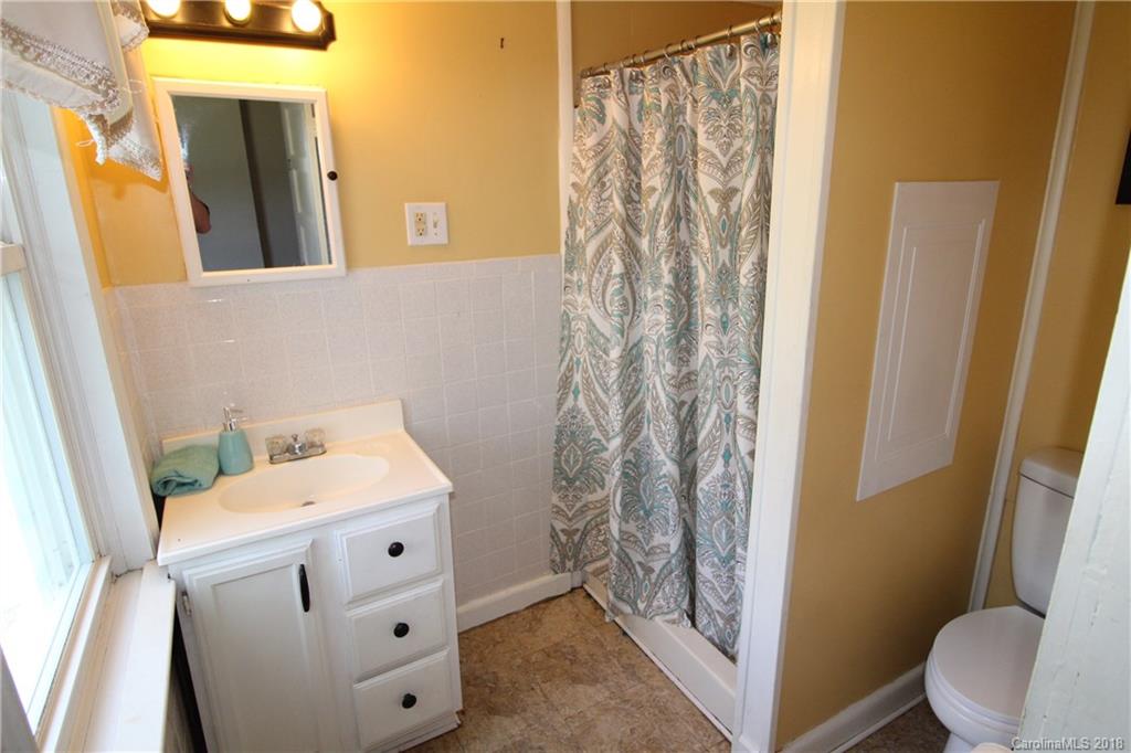 303 McConnell Street, Unit 71 Clover, SC 29710 - Photo 9 of 14 a bathroom with a sink and a toilet