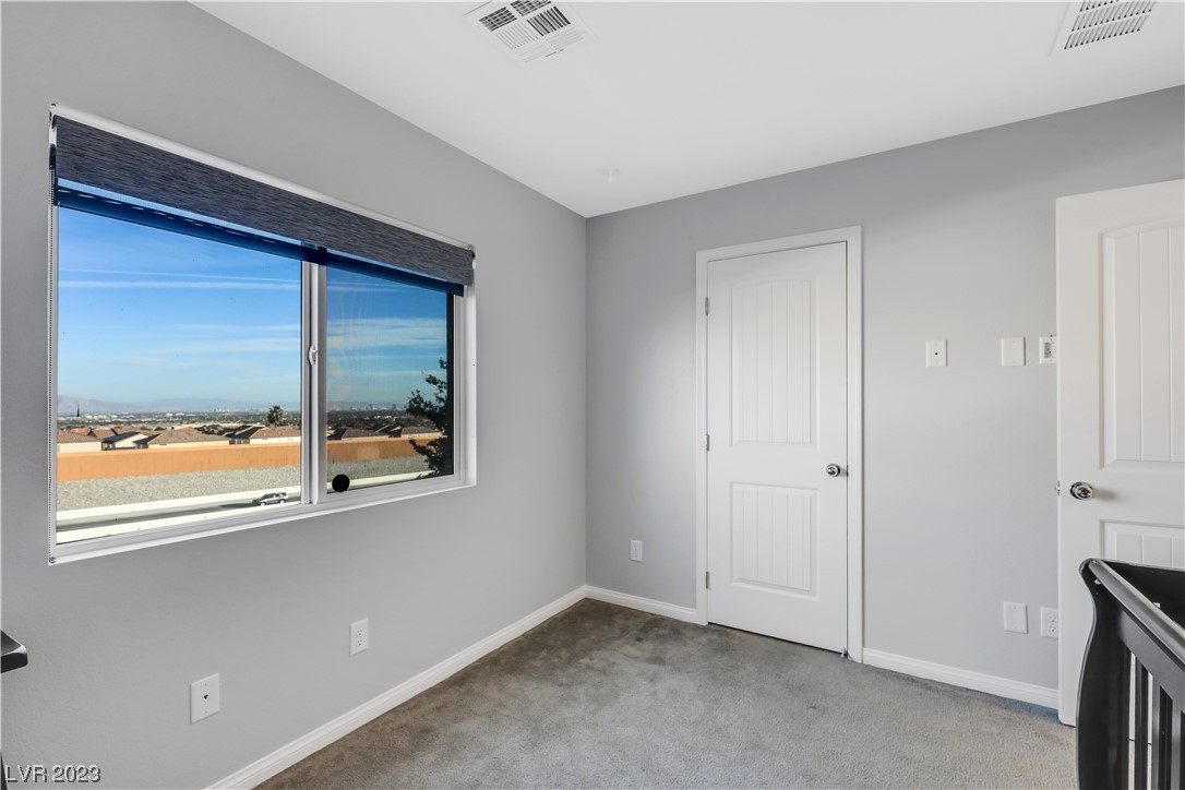 3928 Total Eclipse Street Las Vegas, NV 89129 - Photo 21 of 38 2nd floor bedroom with walk-in closet