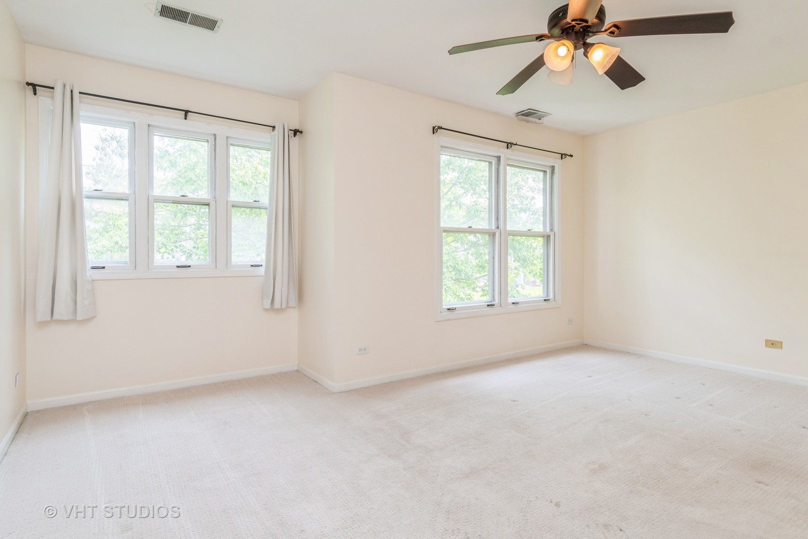 1245 Rhodes Lane, Unit 1245 Naperville, IL 60540 - Photo 12 of 17 a view of an empty room with a window