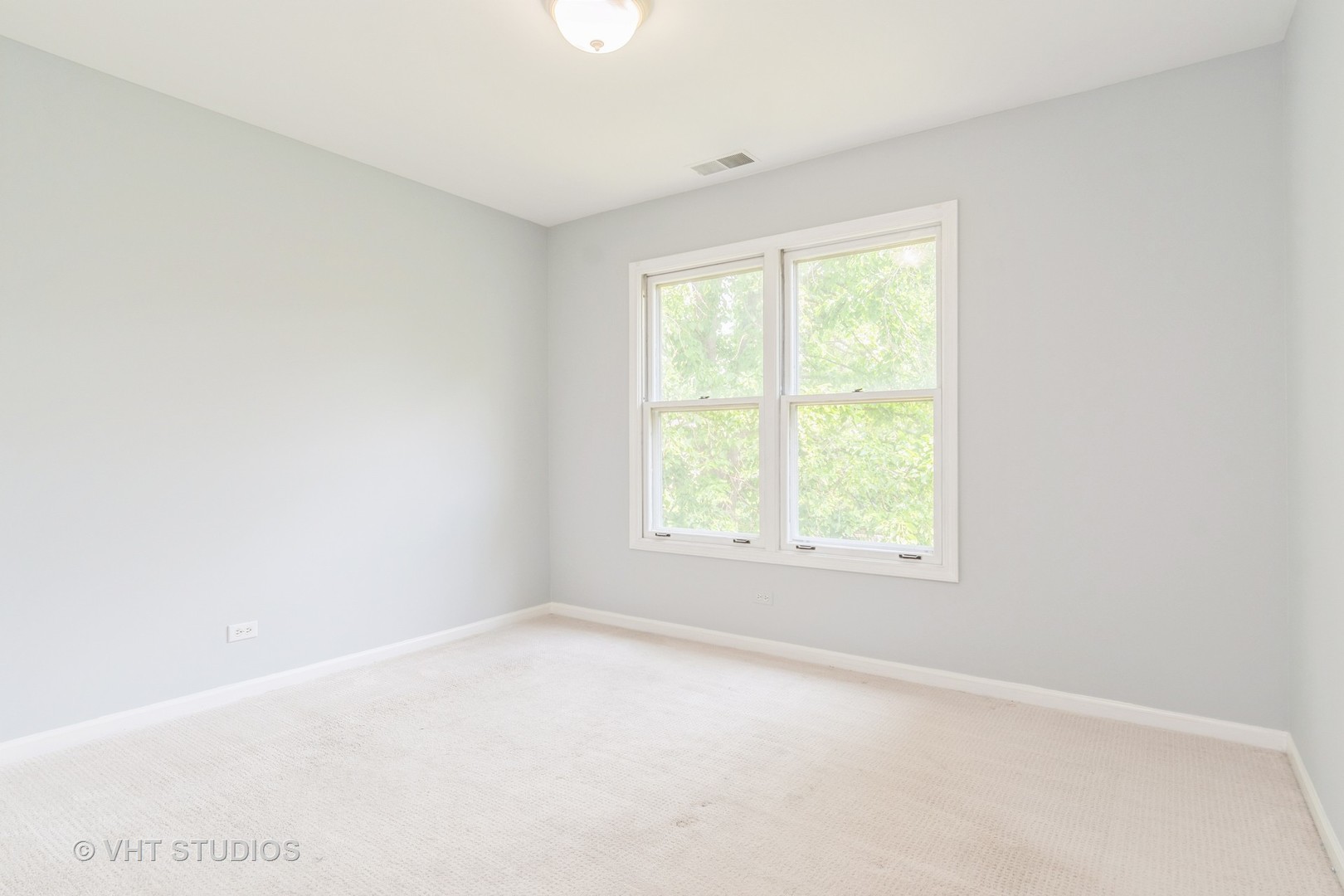 1245 Rhodes Lane, Unit 1245 Naperville, IL 60540 - Photo 14 of 17 an empty room with a window