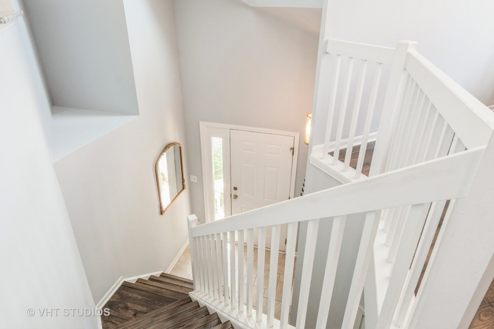 1245 Rhodes Lane, Unit 1245 Naperville, IL 60540 - Photo 3 of 17 a view of a hallway with windows