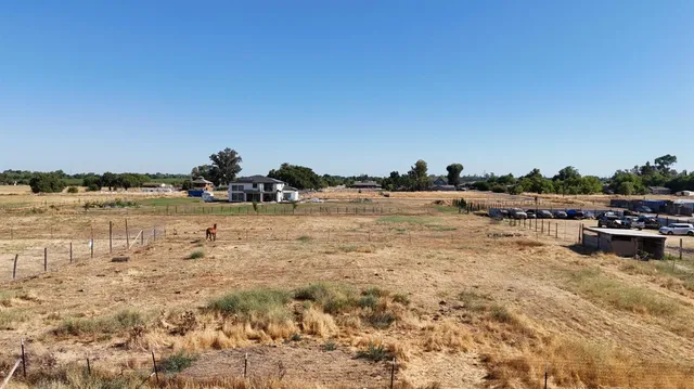 a view of a backyard of a house