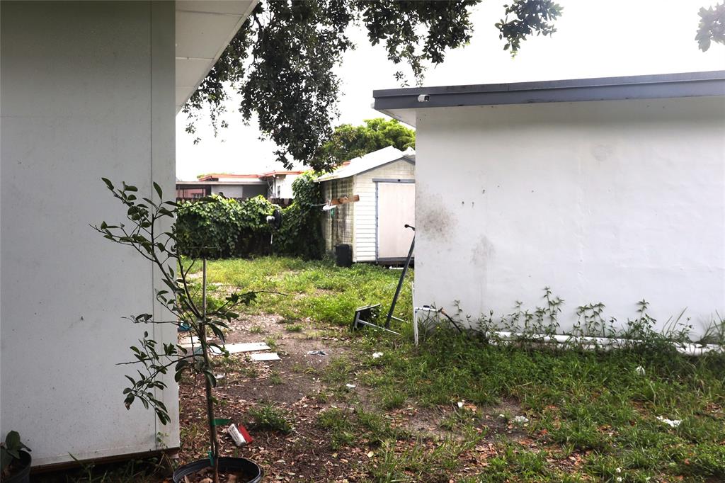 3075 Northwest 68th Street Miami, FL 33147 - Photo 16 of 24 a view of a yard with plants