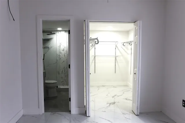 a view of a bathroom with a glass door