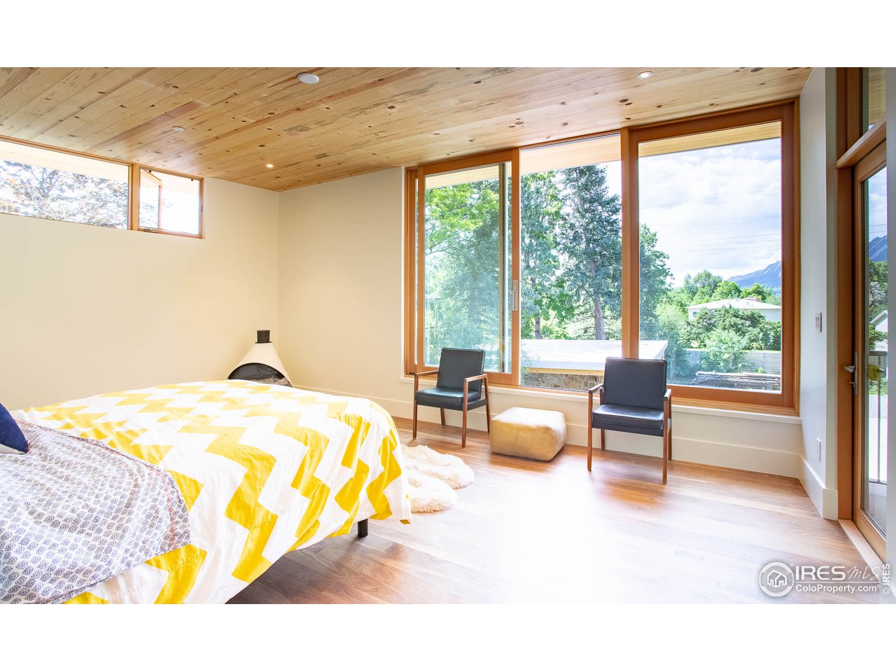 3074 15th Street Boulder, CO 80304 - Photo 26 of 40 a bedroom with furniture and a large window