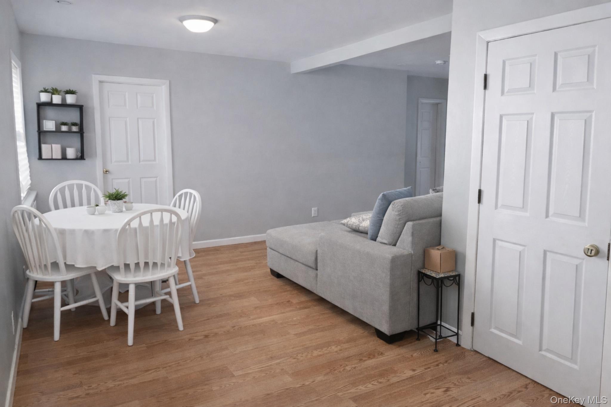 2146 Albany Post Road Montrose, NY 10548 - Photo 2 of 9 a living room with furniture and a wooden floor
