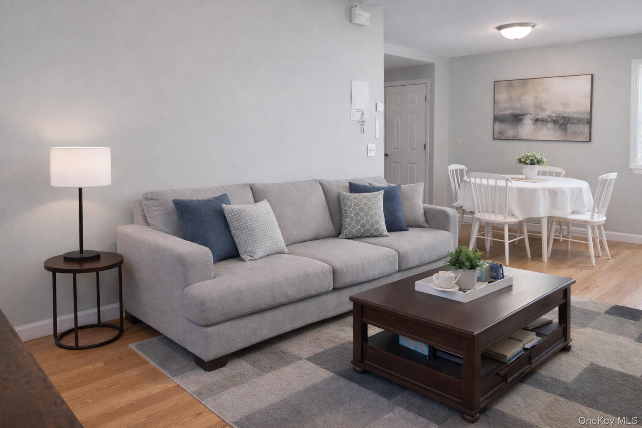 2146 Albany Post Road Montrose, NY 10548 - Photo 3 of 9 a living room with furniture and a lamp