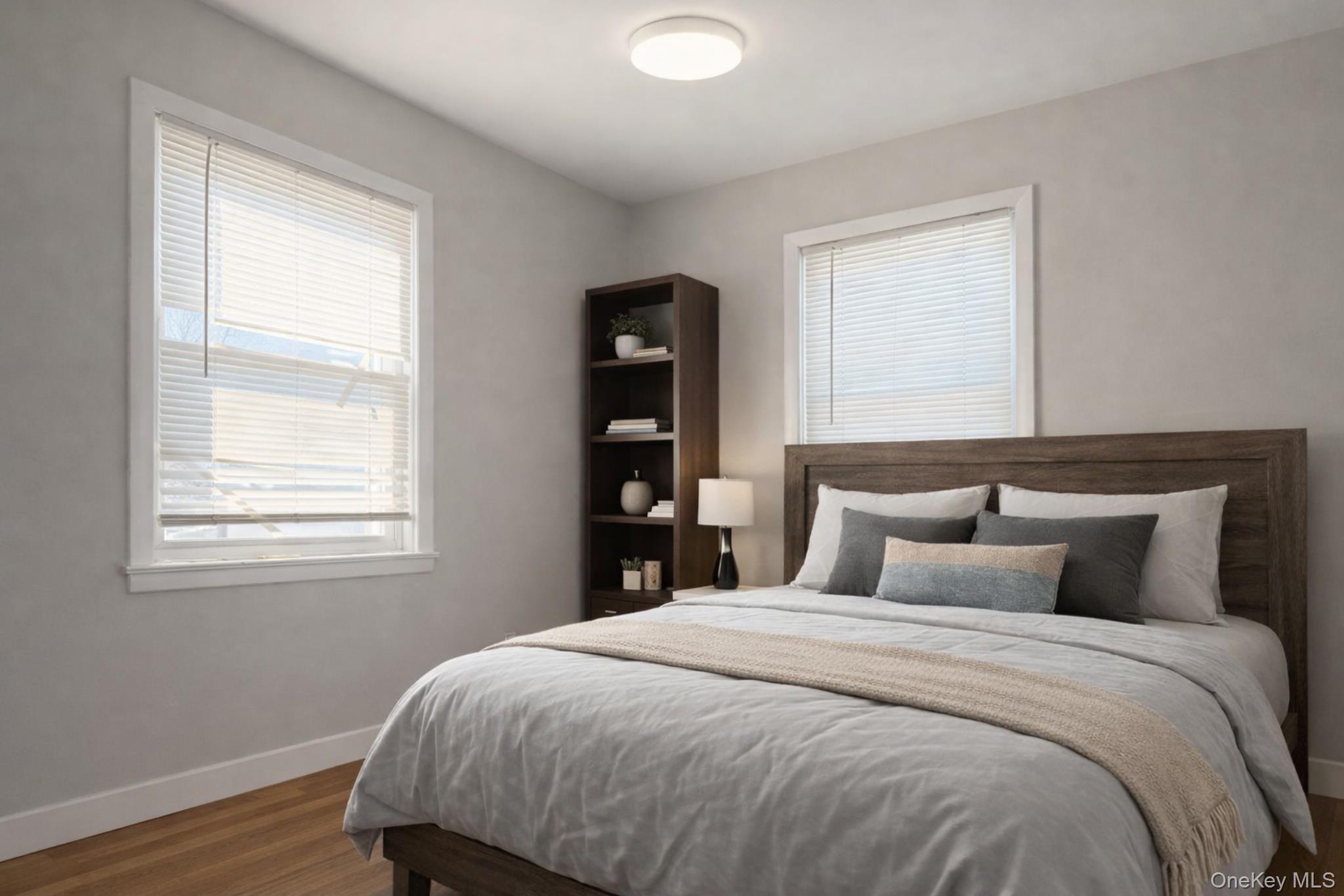 2146 Albany Post Road Montrose, NY 10548 - Photo 6 of 9 a bedroom with a bed and wooden floor