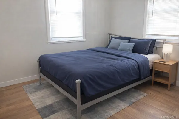a bedroom with a bed and window
