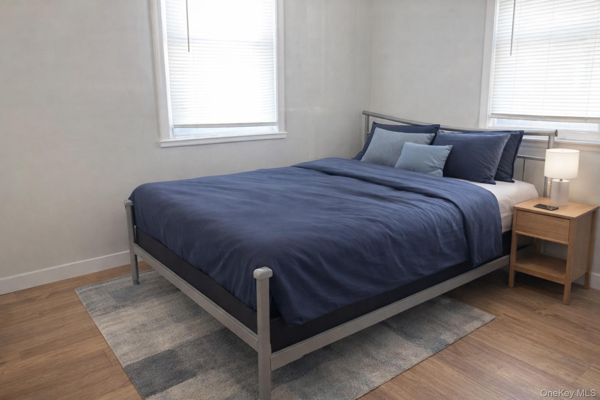 2146 Albany Post Road Montrose, NY 10548 - Photo 8 of 9 a bedroom with a bed and window